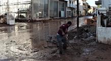 Жизнь в грязи: люди затопленной Аттики живут в разбитых домах (фото)